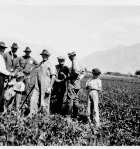 A group of people standing in a field.