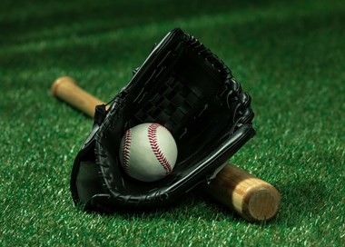A baseball glove and baseball.