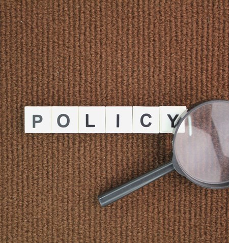 Scrabble pieces that say Policy.