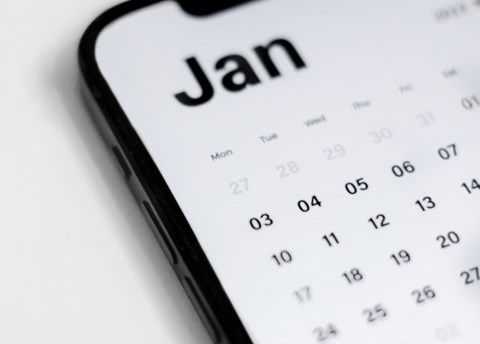 A phone with a calendar that says January.