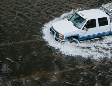 A car driving through water.