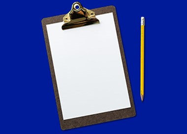 A clipboard with a gold ring.
