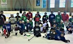 A group of people wearing hockey gear.