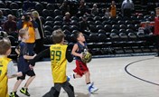 A group of kids playing basketball.
