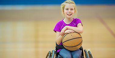Girl playing Wheelchair Basketball
