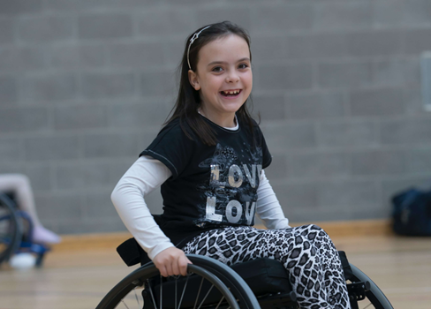 A girl in a wheelchair.